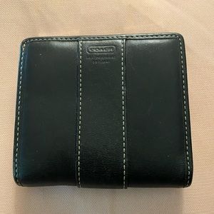 Black leather Coach wallet with change pocket.